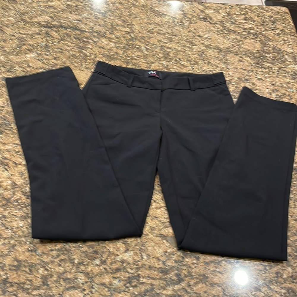 Black slacks with adjustable waist, see pics. Easy to wash. Quality.